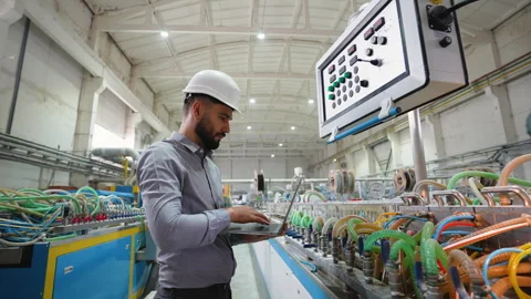 Industrial worker programmer checking the production line with laptop Stock-Footage 314234873