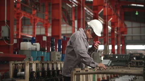 Industrial worker in protective gear experiencing back pain Stock Footage 317905002