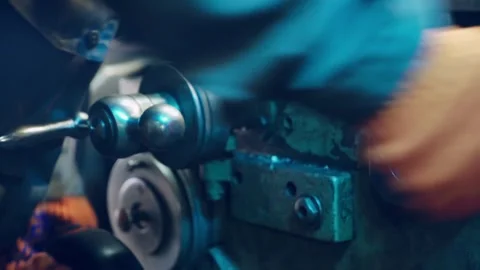 Industrial worker in protective gloves operating vintage metal lathe machin.. Stock Footage 337545142
