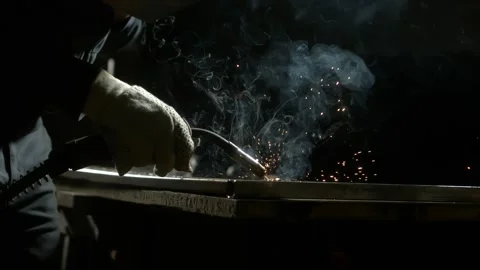 Industrial worker in protective mask welding metal construction with sparks.. Stock Footage 337405689