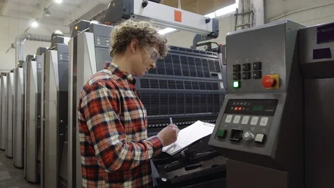 Industrial Worker - Quality Control, controlling and writing the result of the Stock Footage 110795914