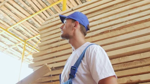 Industrial worker in uniform checking large wooden box on tablet in warehouse Stock Footage 57095193