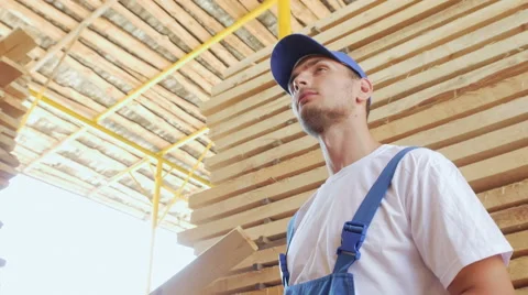 Industrial worker in uniform checking large wooden box on tablet in warehouse Stock Footage 57095208