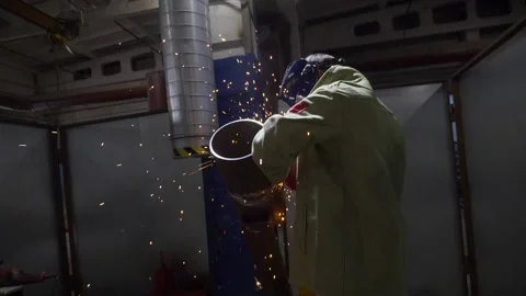 Industrial Worker Using Angle Grinder And Cutting, sparks, slow motion Stock-Footage 130775718