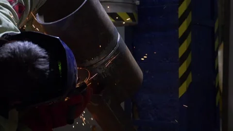 Industrial Worker Using Angle Grinder And Cutting, sparks, slow motion Stock Footage 130775972