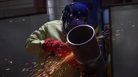 Industrial Worker Using Angle Grinder And Cutting, sparks, slow motion Stock Footage 130776121
