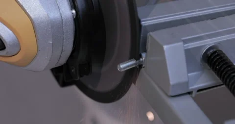 Industrial worker using angle grinder and cutting steel Stock Footage 130994371