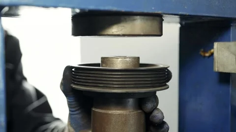 Industrial worker is using hydraulic power press machine to make metal and steel Stock Footage 285643422