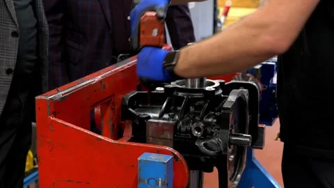 Industrial worker using a professional electric screwdriver to assemble parts Stock Footage 328644911