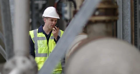 Industrial worker using radio on site Stock Footage 88778090