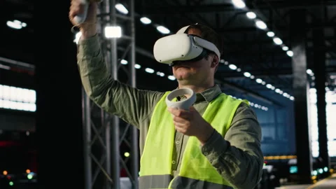 Industrial worker with VR glasses interacting with virtual reality simulation Stock Footage 321915085