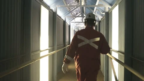 Industrial Worker Walking Through Mining Facility Corridor Stock Footage 339378271