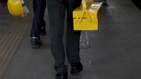 Industrial worker walking with toolbox and safety helmet construction Stock Footage 333684528