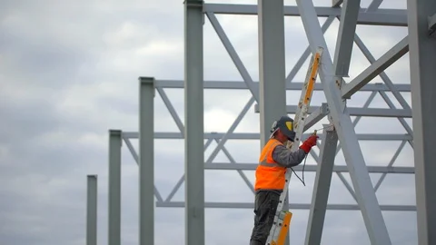 Industrial worker welding of metal structures, welder man male worker soldering Stock Footage 98357880
