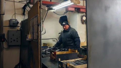 Industrial worker welding of metal structures, welder man male worker soldering Видео 127734658
