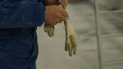 Industrial Worker in Working Clothes Overall Gloves Up Preparing for Work 動画素材 118726617