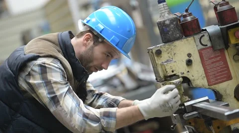 Industrial worker working on machine in factory Stock Footage 46731728