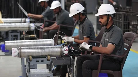 Industrial workers in clean manufacturing plant assembling the wiring systems Stock Footage 328519476