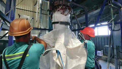 Industrial Workers Handling Bulk Materials, Two priests will pick up a big bag Stock Footage 266715485