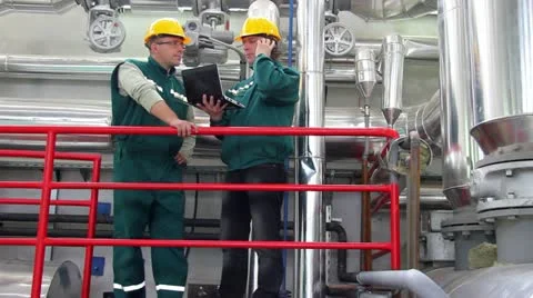 Industrial workers with a notebook and mobile phone Stock Footage 24672789