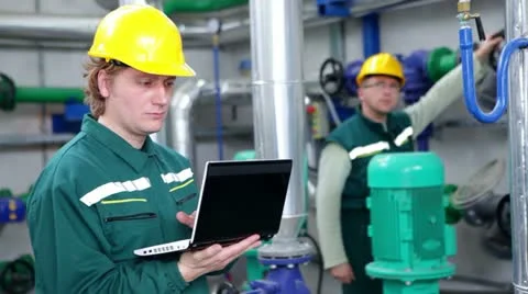 Industrial workers with a notebook Stock Footage 24672619