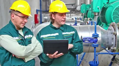 Industrial workers with a notebook Stock Footage 24672639