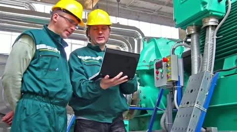 Industrial workers with a notebook Stock Footage 24672646