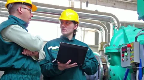 Industrial workers with a notebook Stock Footage 24672653