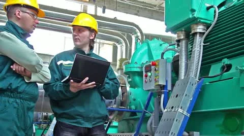 Industrial workers with a notebook Stock Footage 24672658