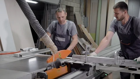 Industrial workers operating on a cutting machine. Stock-Footage 91193468