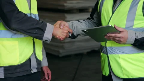 Industrial Workers Shaking Hands After Successful Cooperation in Factory Vídeos de archivo 345012767