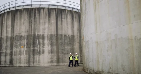 Industrial workers using a digital tablet on site Stock Footage 88769004