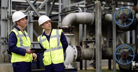 Industrial workers using a digital tablet on site Stock Footage 88772428