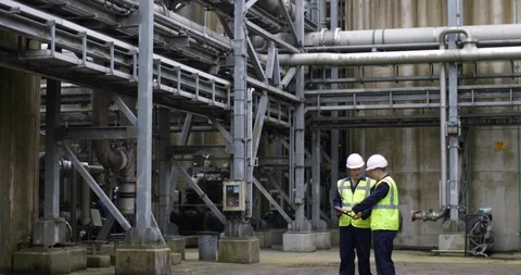 Industrial workers using a digital tablet on site Stock Footage 88775214