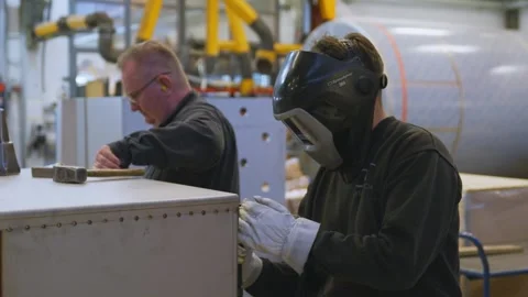 Industrial Workers Welding and Inspecting Metal Structure Stock Footage 332512394