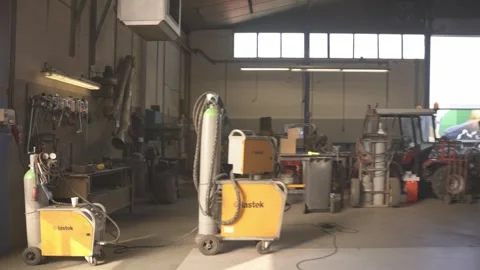 Industrial Workshop Pan Revealing Welding Equipment and Workshop Tools Stock Footage 347064150