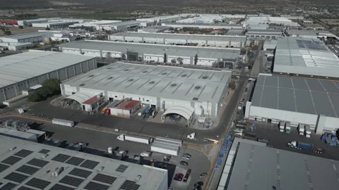 Industrial zone aerial view with huge warehouses semi trucks and logistics park Stock Footage 344913403