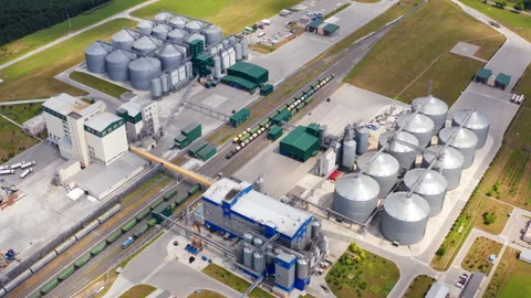 Industrial zone on field. Grain elevators for keeping and drying crop.  Stock Footage 158834280