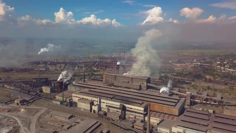 Industrial zone with a large red and white pipe thick white smoke is poured from Stock Footage 95025430