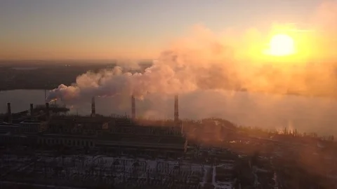 Industrial zone with a large red and white pipe thick white smoke is poured from Stock Footage 102700534