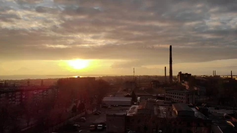 Industrial zone with a large red and white pipe thick white smoke at sunset Stock Footage 104301678
