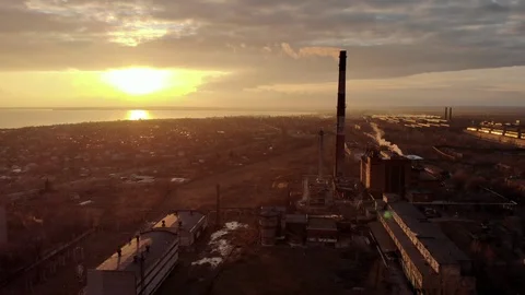 Industrial zone with a large red and white pipe thick white smoke at sunset Stock Footage 104302016