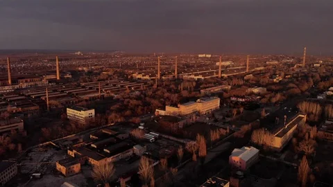 Industrial zone with a large red and white pipe thick white smoke at sunset Stock Footage 104302218
