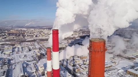 Industrial zone with a large red and white pipe thick white smoke is poured Stock Footage 124467686