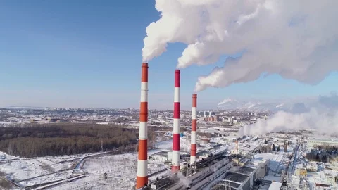 Industrial zone with a large red and white pipe thick white smoke is poured Stock Footage 124469413