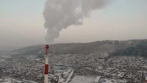 Industrial zone with a large red and white pipe thick white smoke is poured from Video stock 149754066