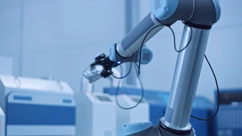 Industry 4.0 Modern Factory: Programmed robot arm Packing Metal Components Stock Footage 124063575