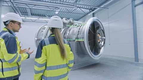 Industry 4.0: Two Engineers Standing, Talking in Factory Workshop with AR Stock Footage 128854761