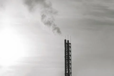 Industry and environmental problems concept - smoke from pipes plant silhouet Stock Photos