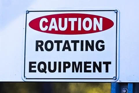 An industry caution rotating equipment warning sign Stock Photos